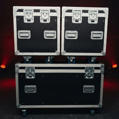 Three black and silver flight cases stacked on a dark background with red lights.